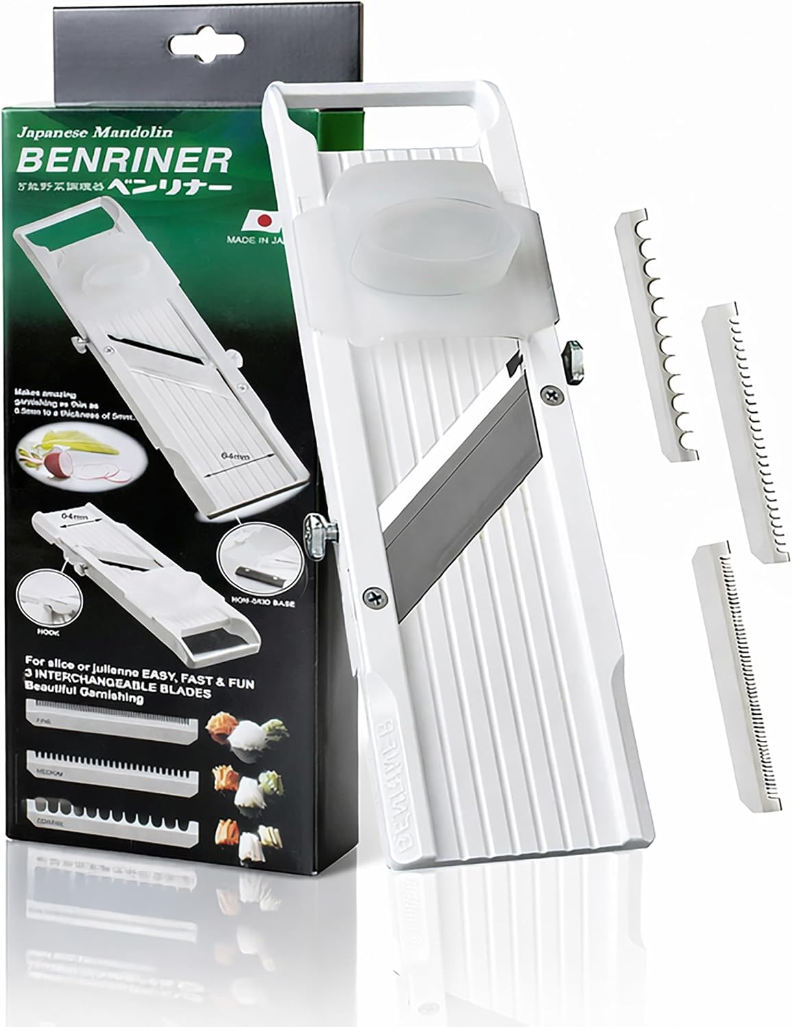 White Benriner mandoline standing upright next to the green Japanese Mandolin BENRINER box, with three comb blades to the right
