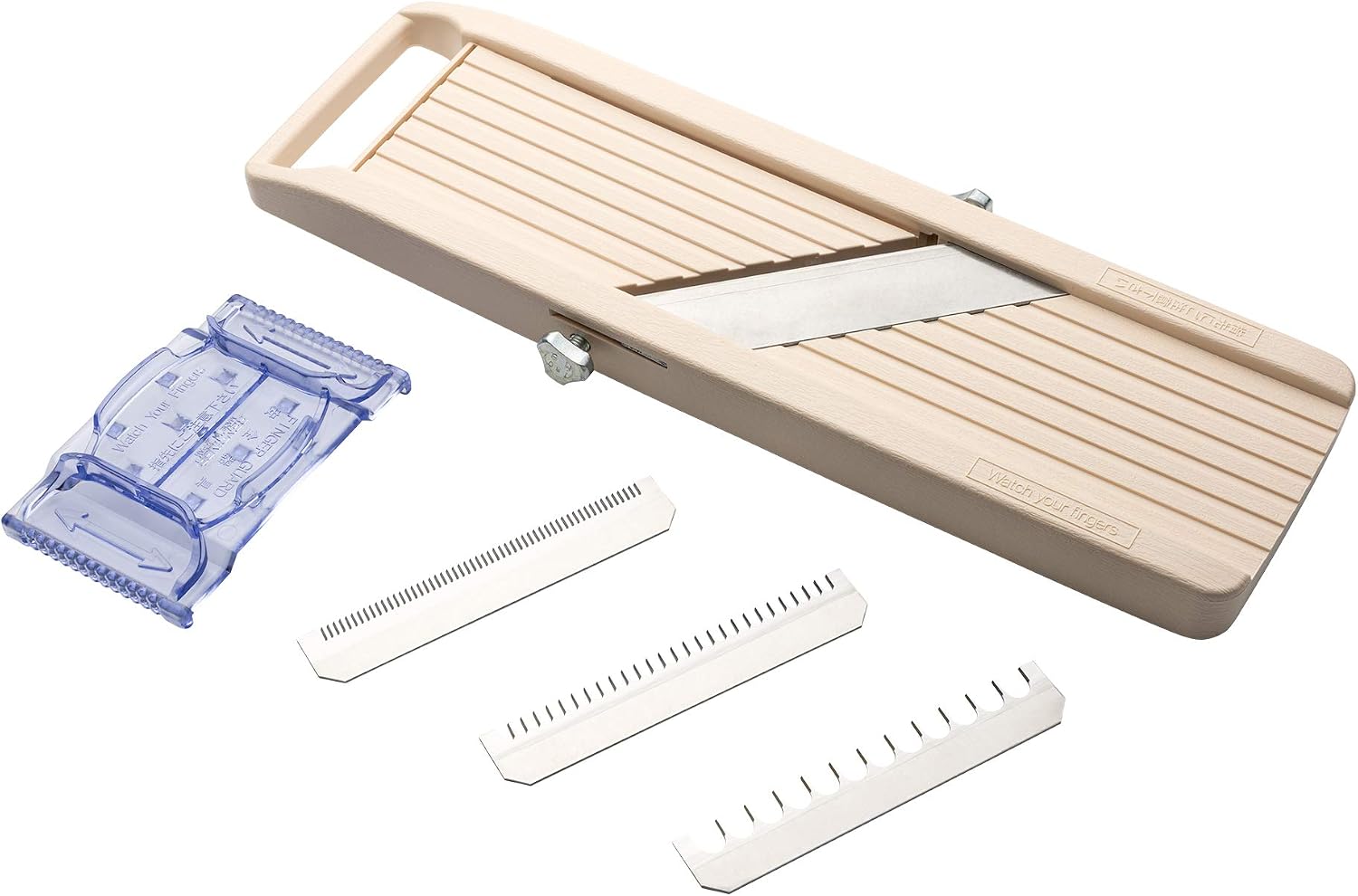 Beige Benriner mandoline with its blue finger guard and three comb blades in fine, medium and coarse spacings laid out beside it